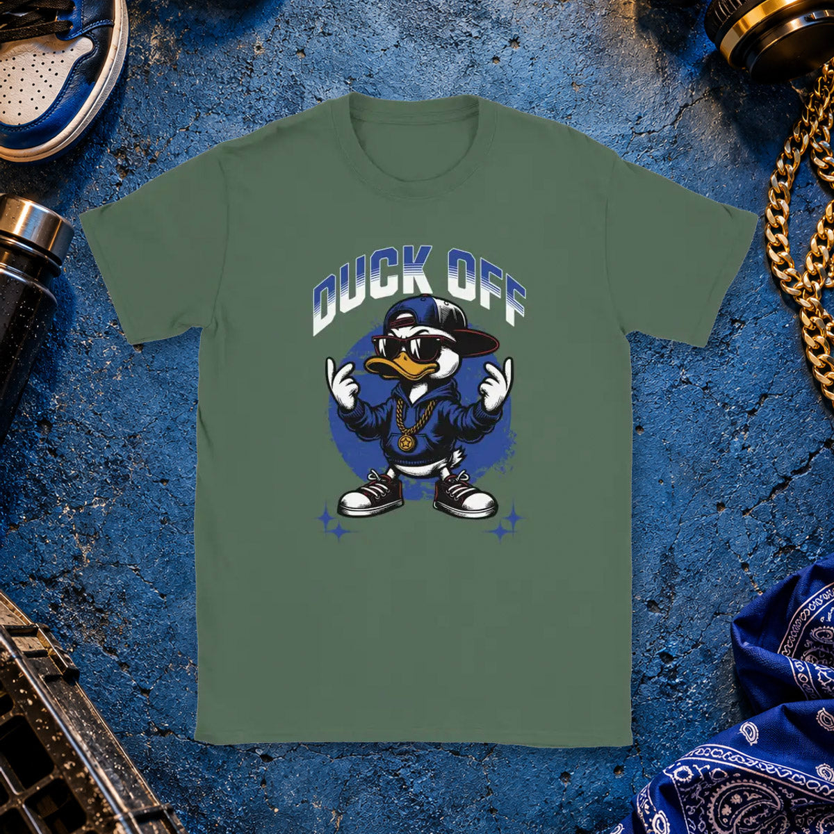 T-shirt featuring a duck in sunglasses and chains making middle-finger gestures beside the words Duck Off.