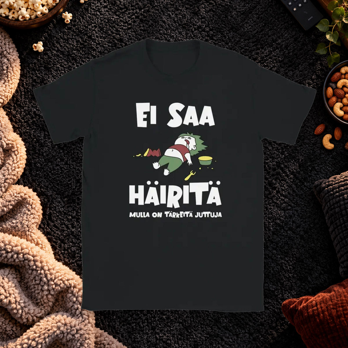 T-shirt featuring a reclining character beside Finnish wording asking not to be disturbed.