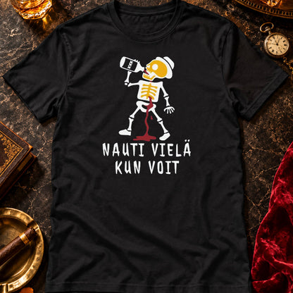 T-shirt featuring a skeleton drinking from a bottle beside the Finnish words NAUTI VIEL� KUN VOIT.