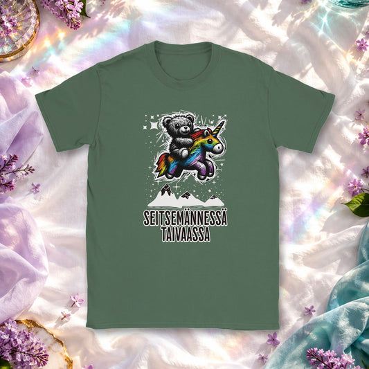 T-shirt featuring a teddy bear riding a colorful unicorn among stars.