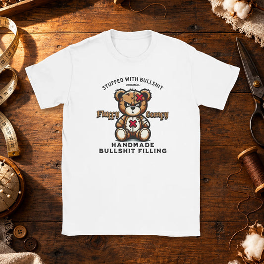 T-shirt featuring a stitched teddy bear beside the words Stuffed With Bullshit.