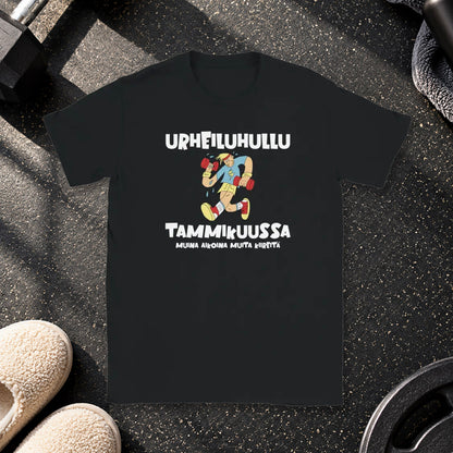 T-shirt featuring an exercising character beside a Finnish joke about being a fitness fanatic in January.