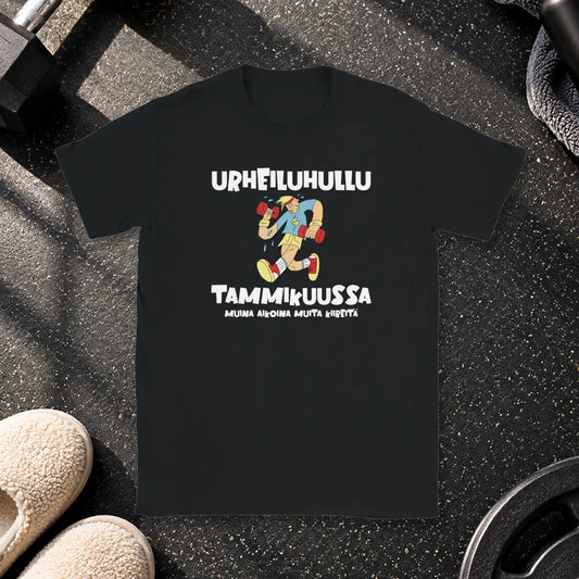 T-shirt featuring an exercising character beside a Finnish joke about being a fitness fanatic in January.