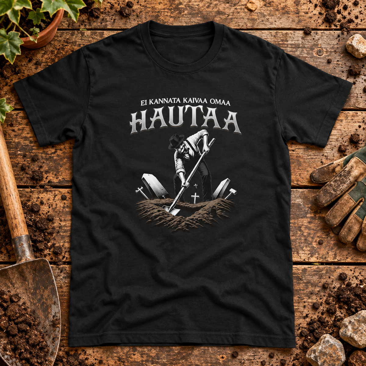 Themed flat-lay photograph of Älä Kaiva Omaa Hautaa - T-paita with accessories related to its printed design.