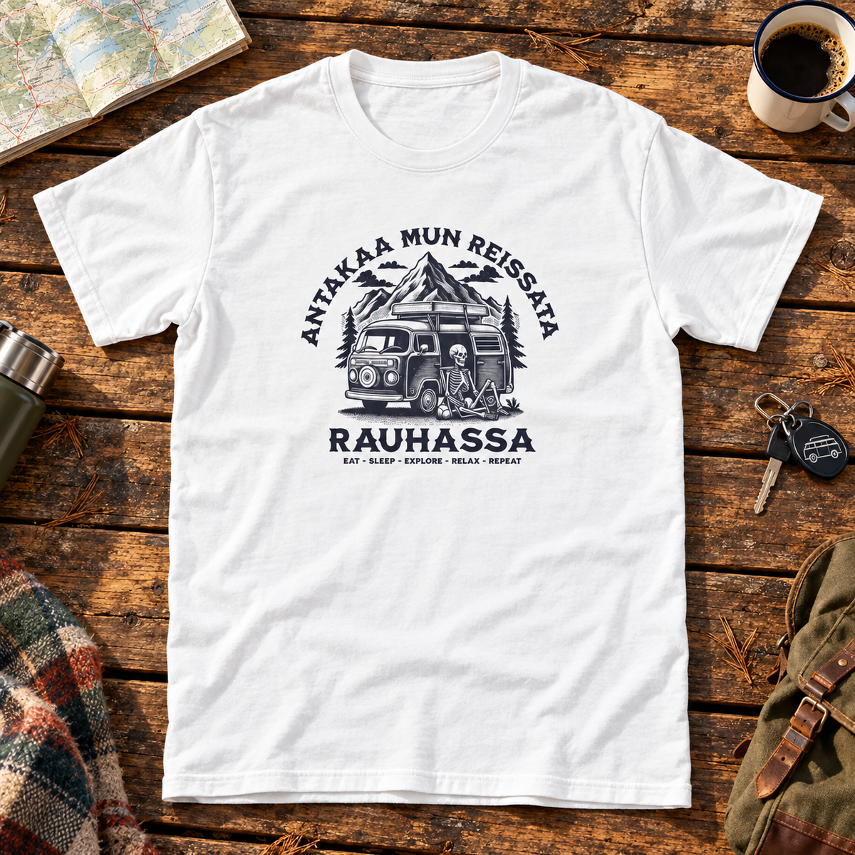 Themed flat-lay photograph of Antakaa Mun Reissata - T-paita with accessories related to its printed design.