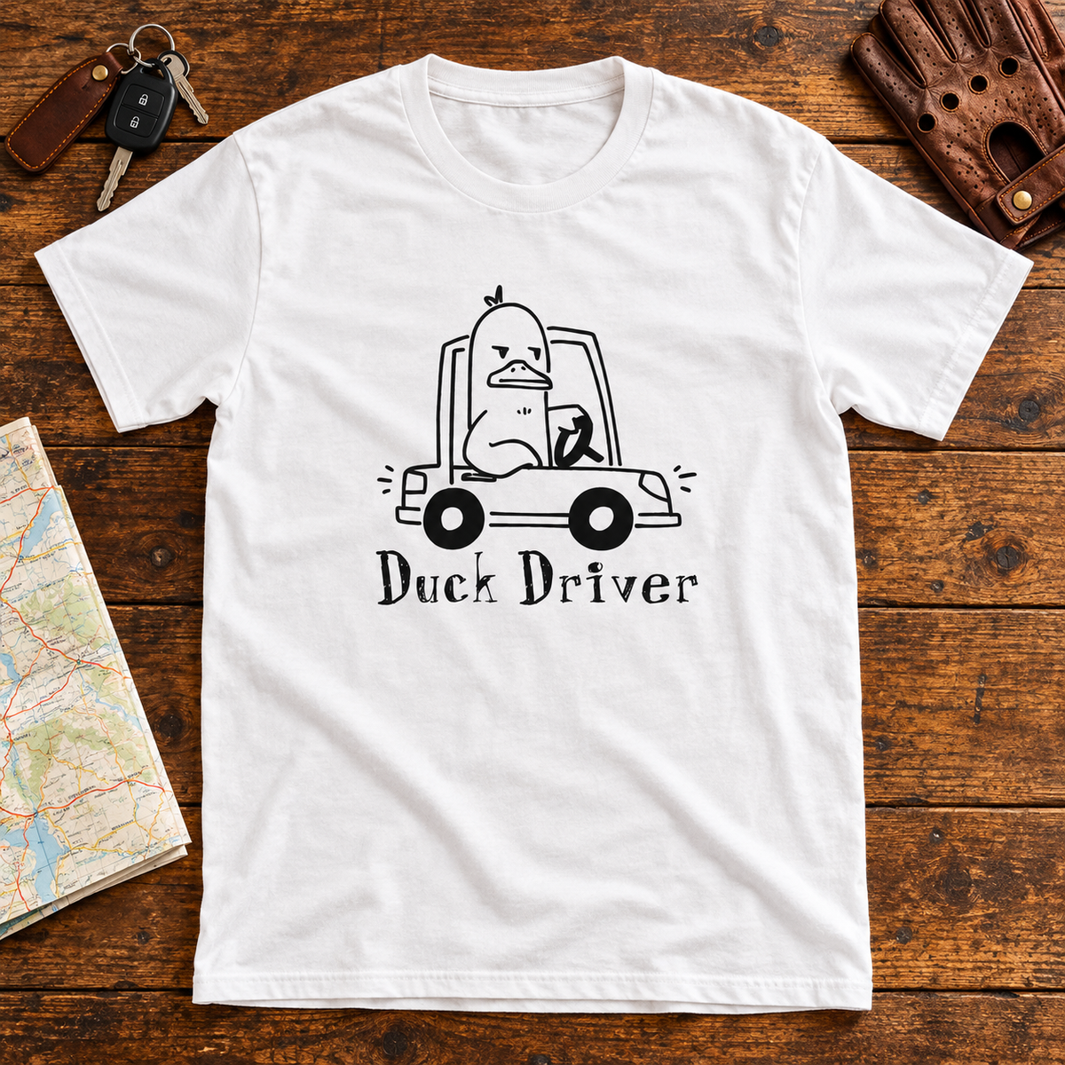 Themed flat-lay photograph of Duck Driver - T-paita with accessories related to its printed design.
