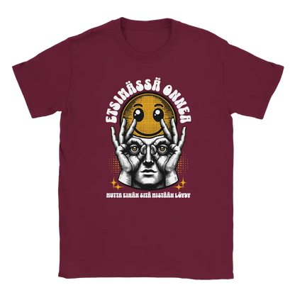 Maroon T-shirt featuring a worried character holding a smiley face beside the Finnish words Etsim�ss� onnea.