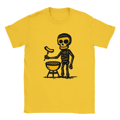 Yellow T-shirt featuring a skeleton beside a round barbecue holding a sausage on a grilling fork.