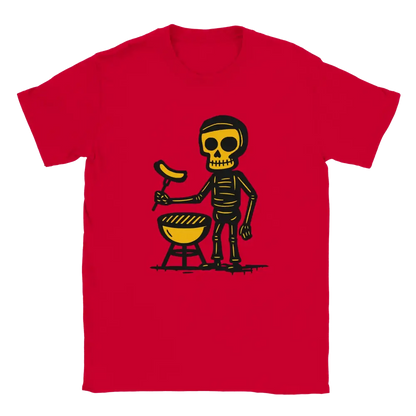 Red T-shirt featuring a skeleton beside a round barbecue holding a sausage on a grilling fork.