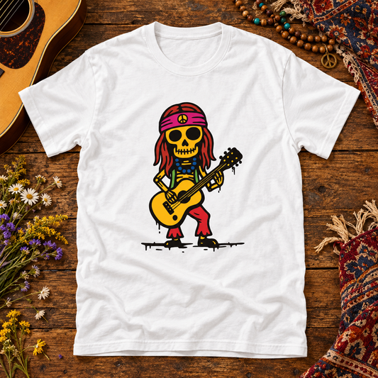 White Hippi skeleton guitarist T-shirt on a bohemian wooden music table with guitar, beads, patterned fabric and wildflowers.