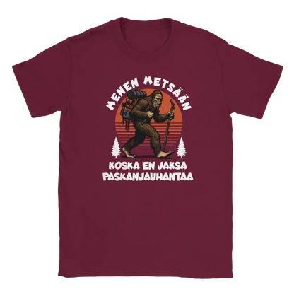 Maroon T-shirt featuring a gorilla hiker with a backpack and stick beside the Finnish words Menen mets��n.