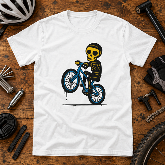 White skeleton cyclist T-shirt in a cycling themed flat-lay with bike accessories.