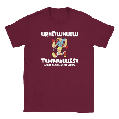 Maroon T-shirt featuring an exercising character beside a Finnish joke about being a fitness fanatic in January.