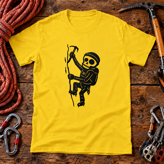 Themed flat-lay photograph of Vuorikiipeilijä T-paita with accessories related to its printed design.